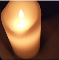White lit electric candle